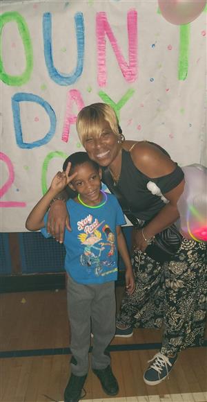 Ms. Tupper takes picture with male students